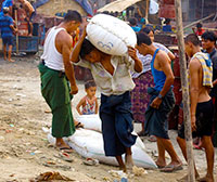 Myanmar - Men Unloading Boat